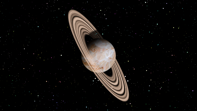 Our ringed planet floats amongst the stars.  Because the rings are not fully opaque, stars shine through them.